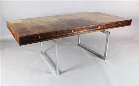 A Bodil Kjær rosewood freestanding working table desk with underframe of chromed steel W.6ft 7in. D.3ft 3in. H.2ft 3in.